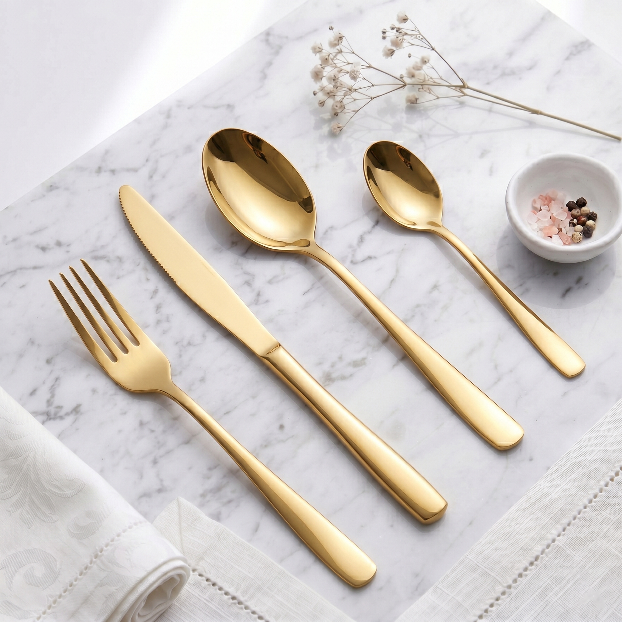 Gold cutlery flatware set on marble
